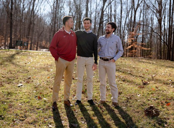 three KA brothers in a field