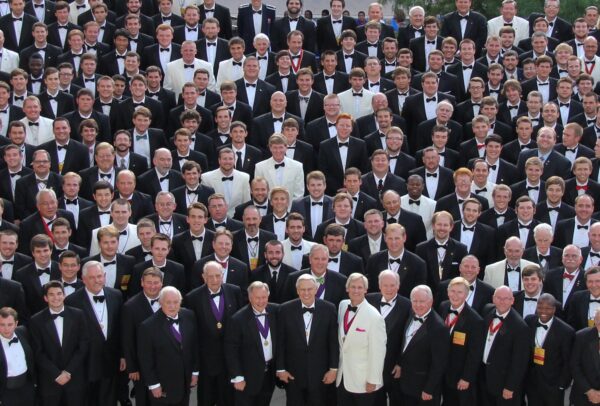 a large group of members in fancy dress attire