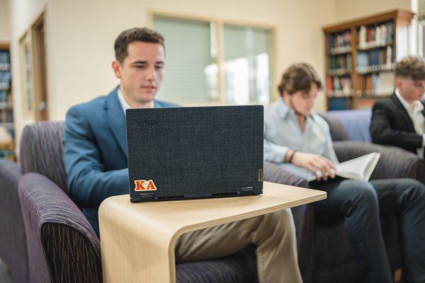 Student working on a laptop in the library