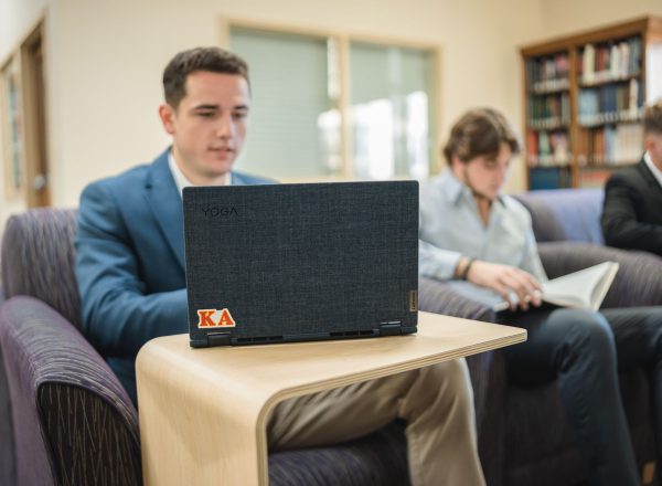 Student working on a laptop in the library