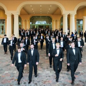Brothers in Tuxes walking to official Convention photo