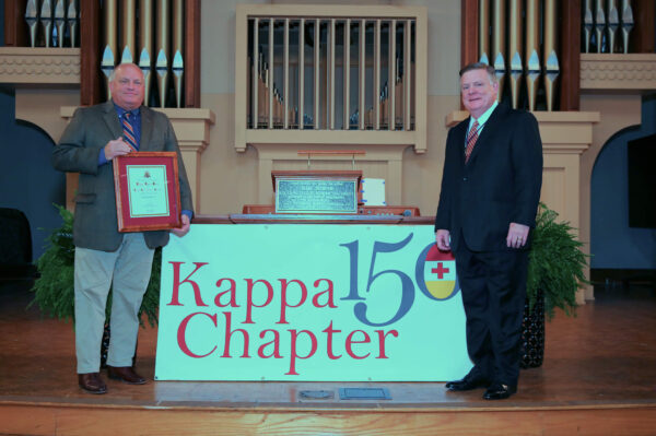 Lee Oliver with Knight Commander Aiken in front of Kappa 150 banner
