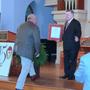 Lee Oliver approaching stage and Knight Commander Aiken