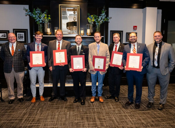 Inductees with certificates and officers