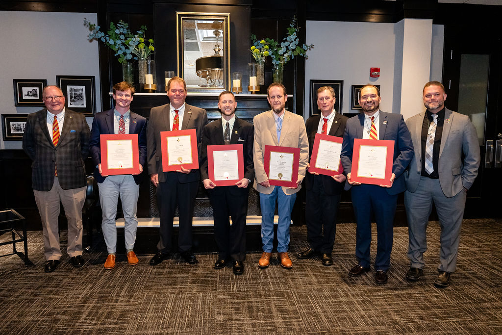 Inductees with certificates and officers