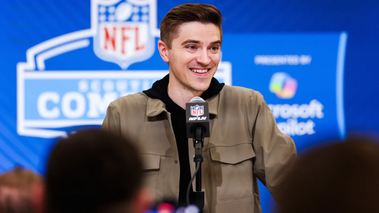 man in front of microphone at press conference