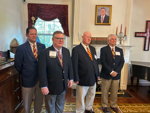 four men in suits