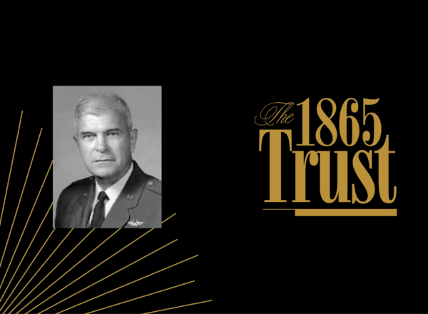 headshot of a man and 1865 Trust logo