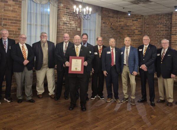 group of men in coat and tie