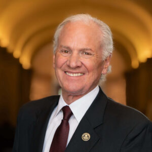 headshot of man in suit